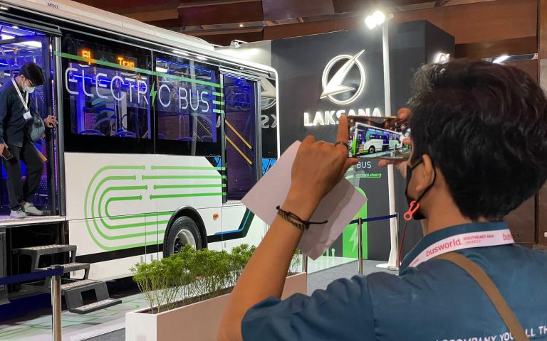 Person taking pictures at Busworld Southeast Asia